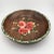A richly patinated mid-century hand-painted wooden bowl featuring vibrant floral decoration in the European folk art...