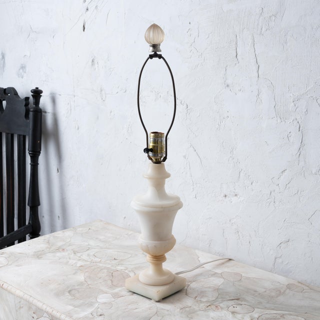 An Italian alabaster lamp, mid-20th Century. 4 ¾ by 23 ½ inches tall; 11 ¾ measured to top of alabaster