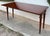 This elegant 20th-century console table, crafted in the Louis XVI style, features a refined design with clean neoclassical...