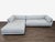 Upgrade your living space with this Blu Dot sectional sofa. It features a modern design with clean lines and a light gray...