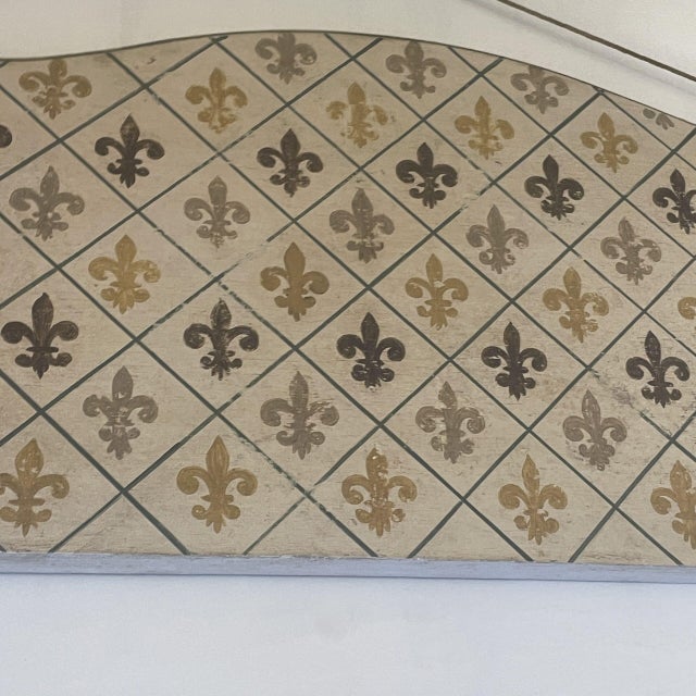 Pair of small polychrome wooden headboards. Decorated with a geometric diamond pattern featuring the Fleur-de-lis, painted...