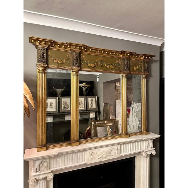 An attractive late Georgian over mantel mirror dating circa 1790. The hand painted frieze still vibrant and intact and...