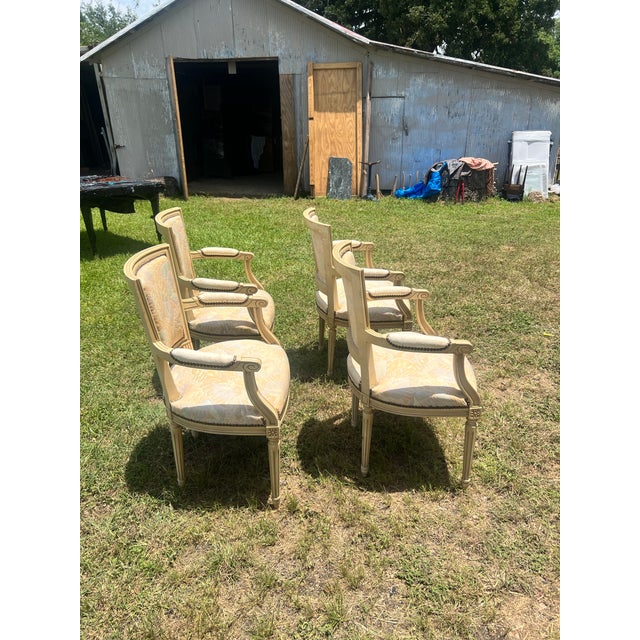 Elegant set of four 19th-century French Louis XVI armchairs, crafted in carved beechwood with fluted legs and classic...
