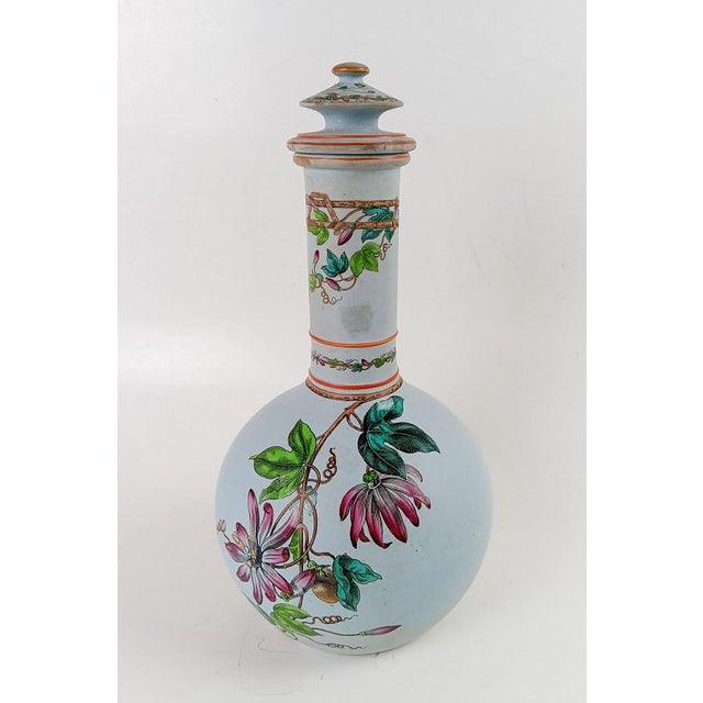 Antique Copeland matte bisque blue porcelain decanter. Enameled hand painted purple passion flower vine decoration. No...