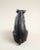 A charming vintage cast iron pig figure featuring a simple folk-art inspired design and substantial weight. Finished in a...