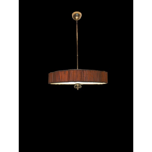 This magnificent lamp is an exceptional masterpiece from the golden age of Finnish lighting design: a large pendant lamp...