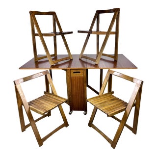 Mid Century Modern Drop Leaf Storage Dining Table and Folding Chairs For Sale