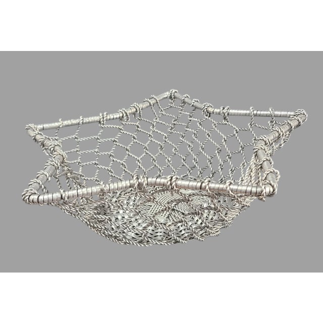 Elevate your home decor with the Contemporary Festive Patriotic Aluminum Star Shaped Woven Wire Basket, a piece that...