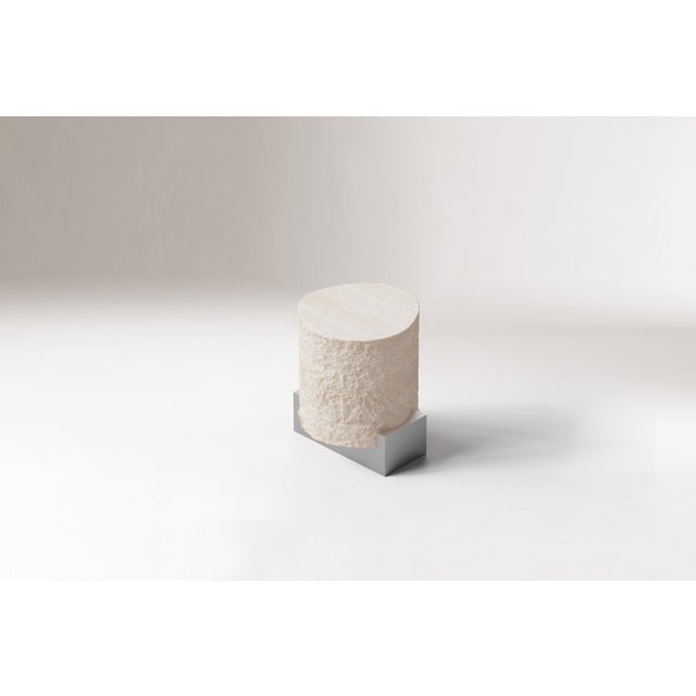 A harmonious exploration of contrasts, the On the Rocks table bridges the organic and the futuristic. with a hand-hammered...