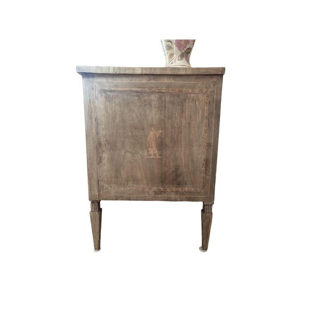 19th Century bleached oak chest of drawers. Featuring marquetry details on all sides, a statement piece for sure. Includes...