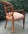 Beautiful accent by Edward Ferrell. Features elaborate spiderback , carved legs and arm rest. Upholstered seat. Made in...