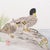 This charming watercolor is composed in the style of traditional ink calligraphy and depicts two ducks resting on a river...