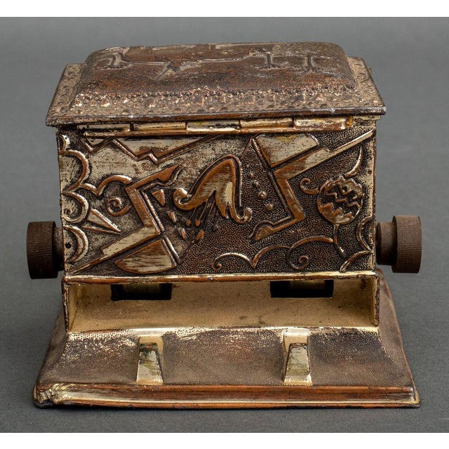 Art Deco Cigarette Dispenser, silvered metal, double-sided with elephant and palm trees motif, marked "Made in Japan" to...