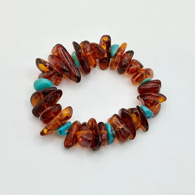 A gorgeous Boho Chic polished natural Baltic Amber nuggets bracelet. There are also a handful of faux turquoise nuggets...