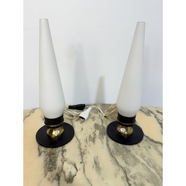 Set of two Italian bedside lamps in the Stilnovo style, 1950 Cone-shaped opaline glass lampshade and metal and brass...