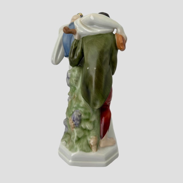 A charming and beautifully modeled vintage Herend porcelain figural group depicting two animated musicians or revelers in...