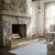 A beautifully detailed vintage brass fireplace fender featuring a graceful scalloped crest rail and finely pierced...