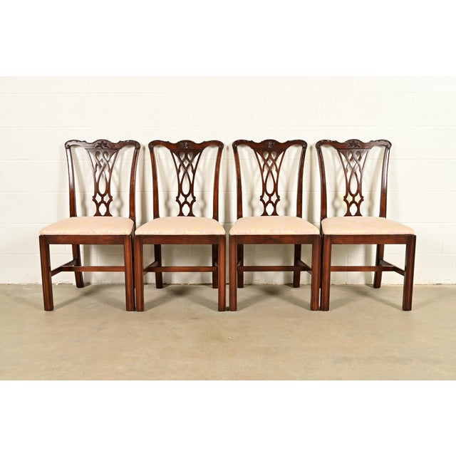 An outstanding set of four Georgian or Chippendale style dining chairs In the manner of Baker Furniture USA, Circa 1980s...
