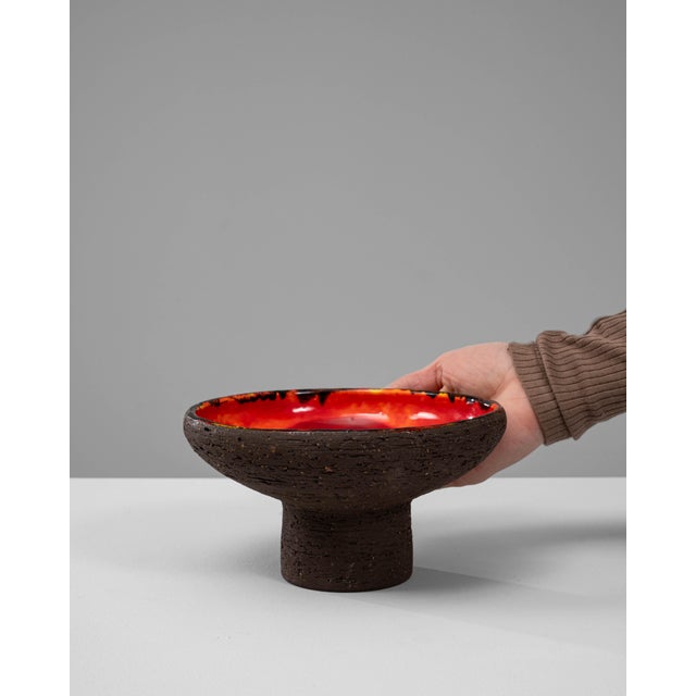20th Century German Ceramic Vase. This striking ceramic vase embodies the bold, textured aesthetic associated with...