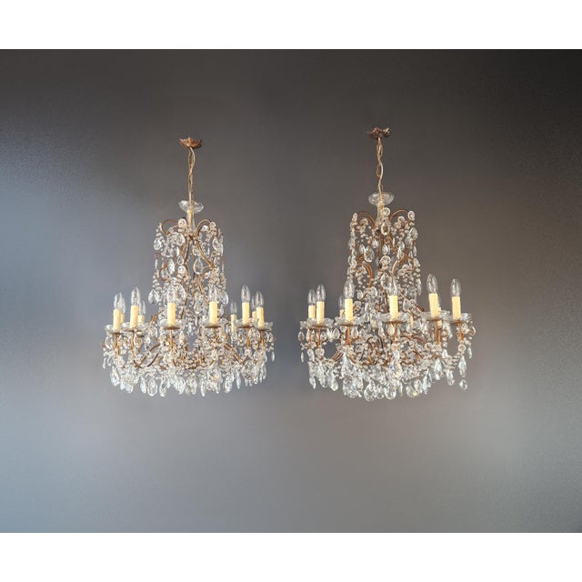 An exceptional pair of crystal chandeliers, distinguished by their balanced proportions and refined craftsmanship. Both...