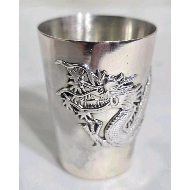 A fine late 19th-century Chinese Export Cantonese silver cup or beaker of elegant tapered form. The body is decorated in...