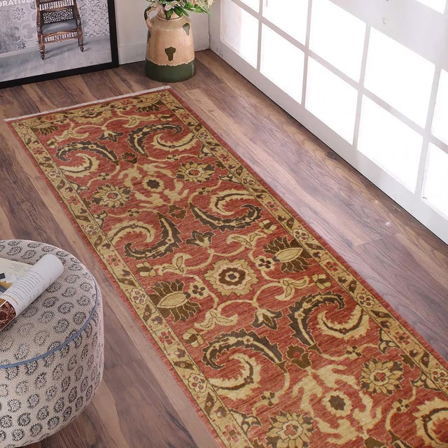 Enhance the ambiance of your home with this magnificent Persian-influenced Turkish hand-knotted rug made by skilled...