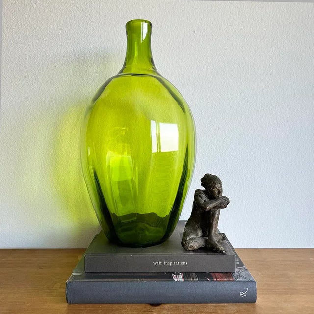 Here we have an eye-catching early-to-mid 20th century hand-blown yellow-green glass jug that is a great example of...