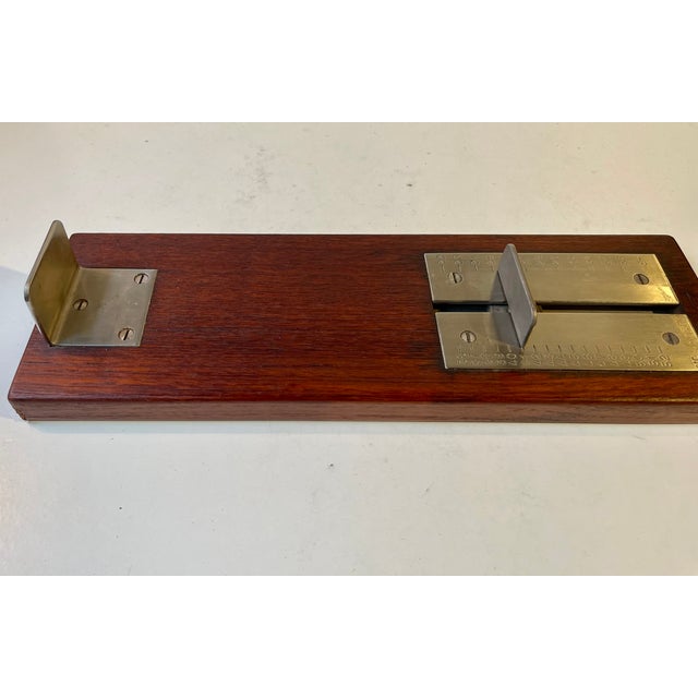 A high-quality shoe size / foot measurer fashioned from solid teak and stainless steel. It can be wall-hung via a small...