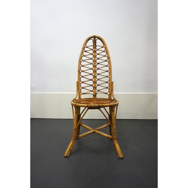 Bamboo chair with a high back. This is a 1960s design, extremely decorative with a very organic and sculptural presence....