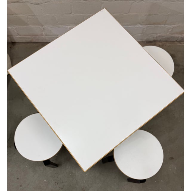 A design classic to fall in love with: alvar aalto's '81c' table, paired with the 'stool 60' in a stunning special color...