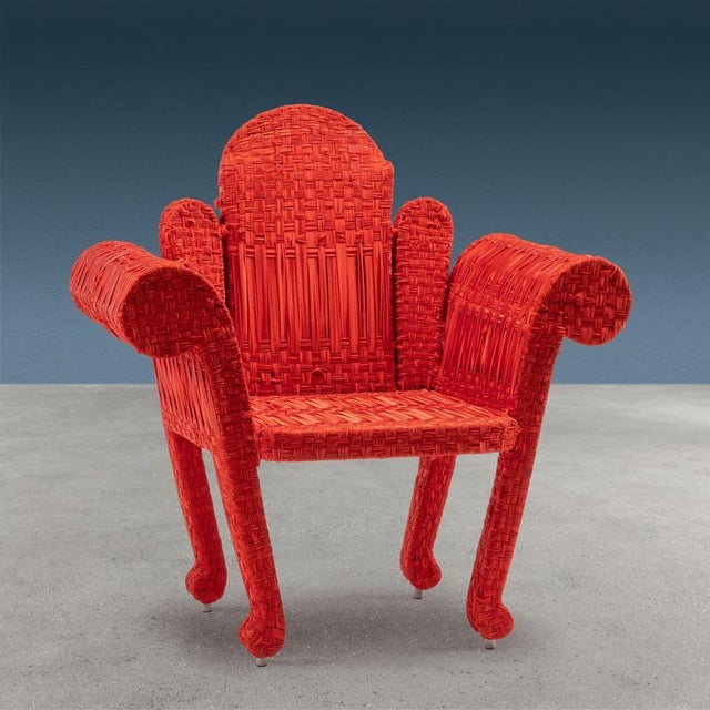 Armchair designed and created by Anacleto Spazzapan by welding an iron rod and then embellishing it with red fabric...