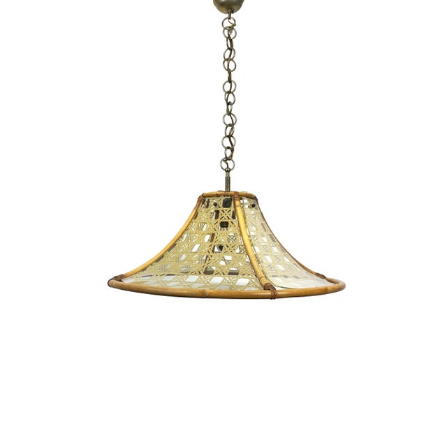 Mid-Century Italian chandelier in textured glass and rattan featuring bamboo structure and metal pendant, circa 1960. Up...