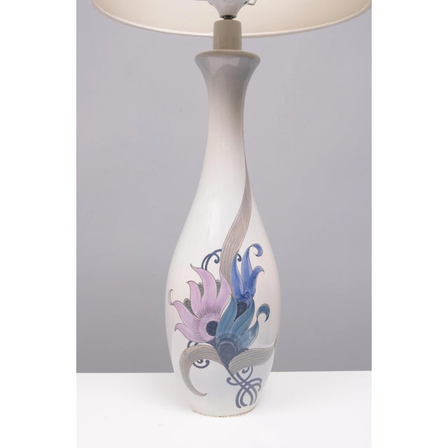 Very nice elegant pair of Ceramic Table Lamps ,Hand painted Flowers. Light Blue base color. Unique rare set, Signed....