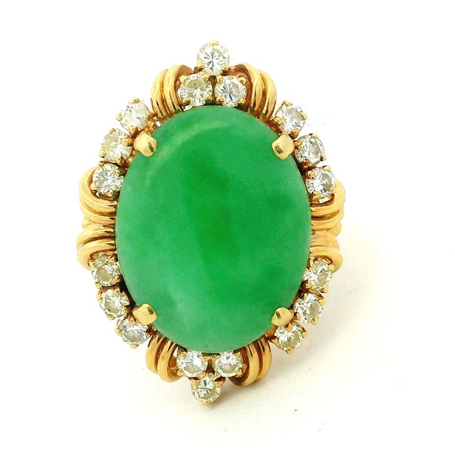 A beautiful Italian statement ring dating to circa 1970, centered by a substantial oval green jadeite cabochon measuring...