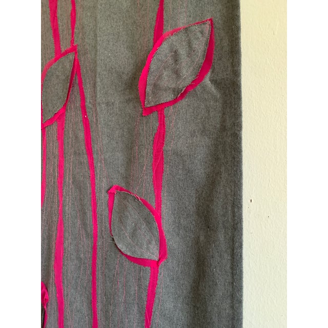 A bold and expressive sculpted textile work, featuring layered appliqué, machine top-stitching, and striking 3D surface...