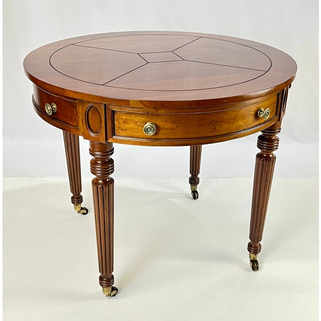 A very fine pair of solid cherry drum tables from Henredon's Registry Collection. These tables feature solid cherry...