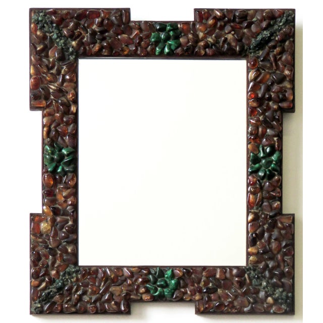 A genuinely rare jeweled cruciform mirror. The mirror consists of hand laid mosaic semi-precious stones comprised...