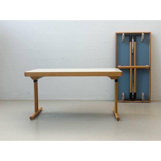 This high-quality folding table from hiller impresses with its durable, functional construction and timeless design. The...