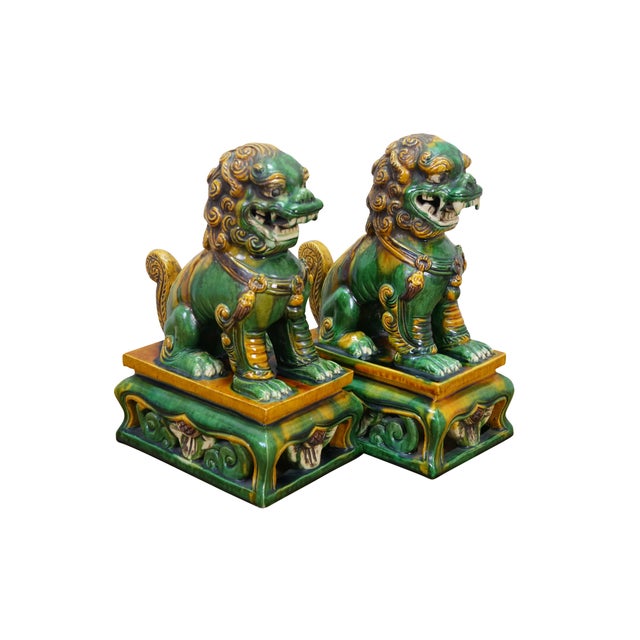 Two vintage Chinese famille verte green and gold Sancai glazed porcelain foo dogs / guardian lion sculptures / statues /...