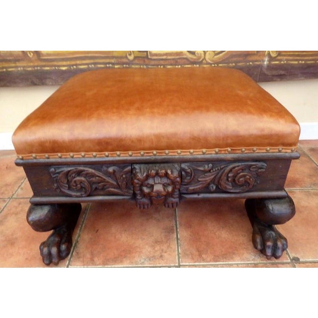 An impressive early 19th-century country oak stool, dating from circa 1830–1850 and distinguished by bold hand-carved lion...