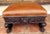 An impressive early 19th-century country oak stool, dating from circa 1830–1850 and distinguished by bold hand-carved lion...