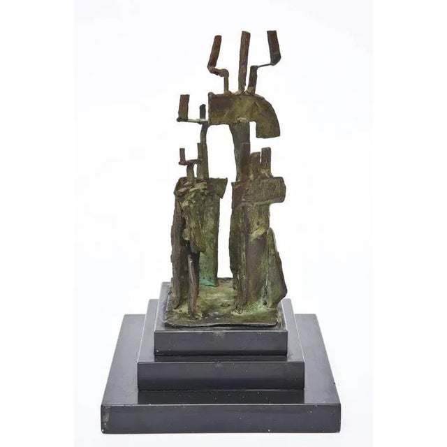 This vintage three-step black marble base is home to the bronze midcentury modern sculpture by Irma Stoloff, a NY artist....