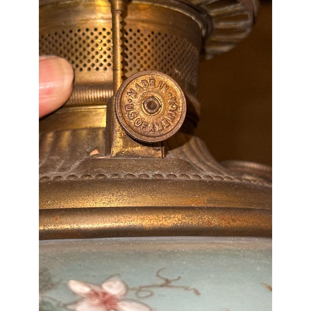 This exquisite late-Victorian "Gone with the Wind" style parlor hurricane lamp features a beautifully coordinated two-tier...