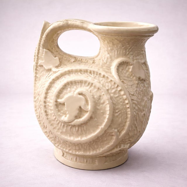 An authentic 1930s Art Deco cream serving pitcher by Burleigh Ware, beautifully moulded with bold spiral and foliate...