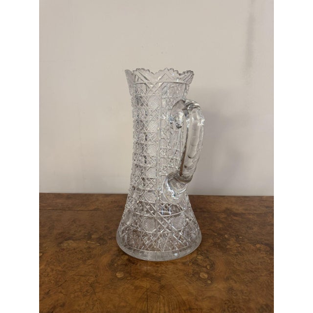 Outstanding quality large antique Edwardian cut glass jug, having an outstanding quality cut glass large jug with...