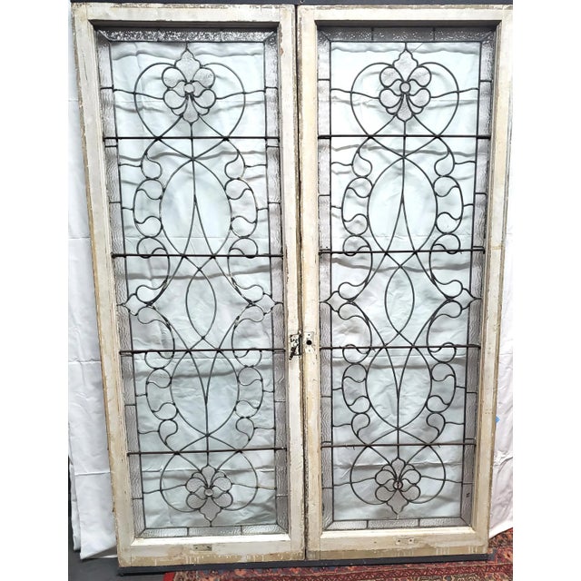 Pair of late 19th or early 20th century elegant and impressive leaded glass casement style cabinet doors having an...