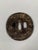 Tsuba Maru-Gata, Edo period (1603-1868). Wrought iron inlaid with copper, silver, and gold. Depicts a sage seated by a...