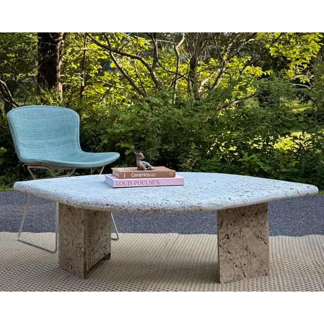 A striking vintage 1980s Postmodern coffee table with a thick, solid-stone top in a graceful biomorphic form; part...