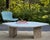 A striking vintage 1980s Postmodern coffee table with a thick, solid-stone top in a graceful biomorphic form; part...