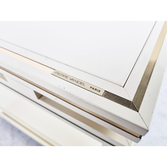 Beige lacquered metal and brass two tier trolley by Pierre Vandel. Ideal as a side table next to your sofa, or to serve...